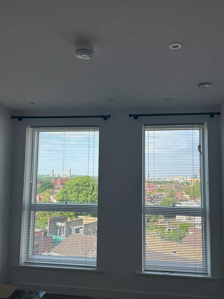 Double-window curtains hung level
