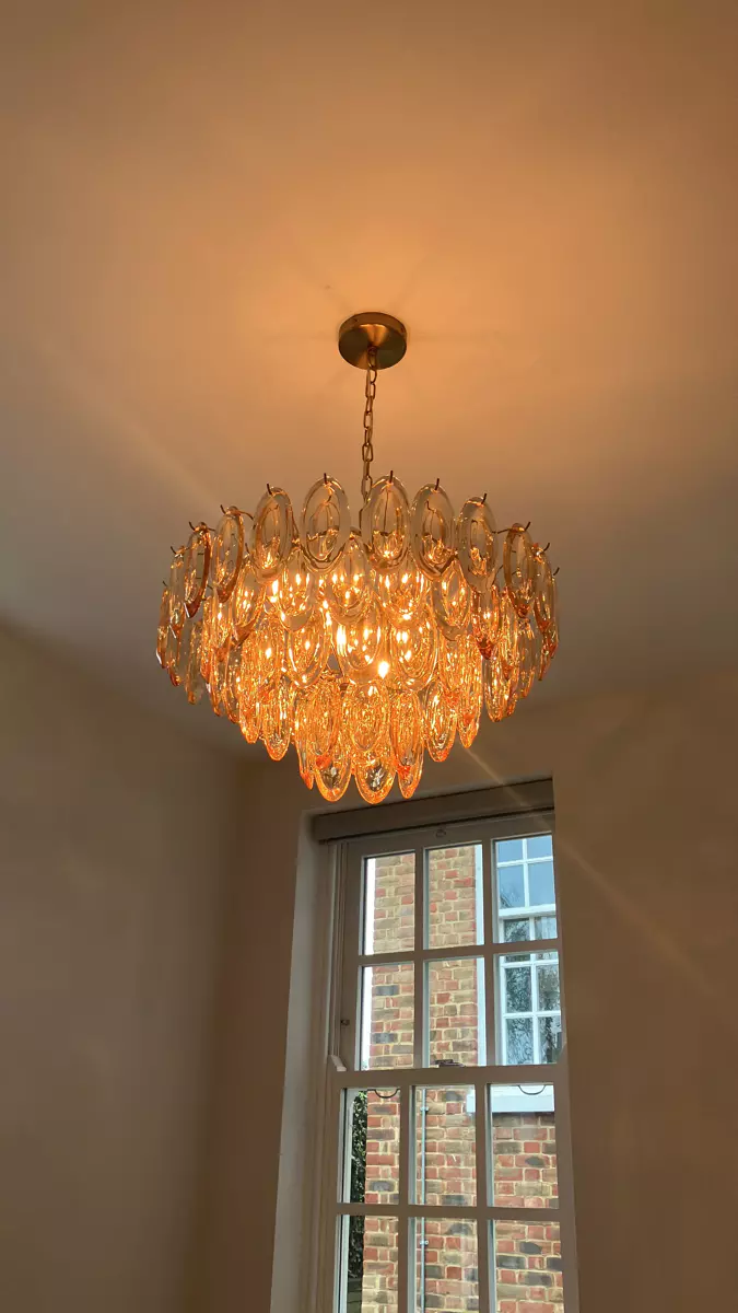 Second amber chandelier installed